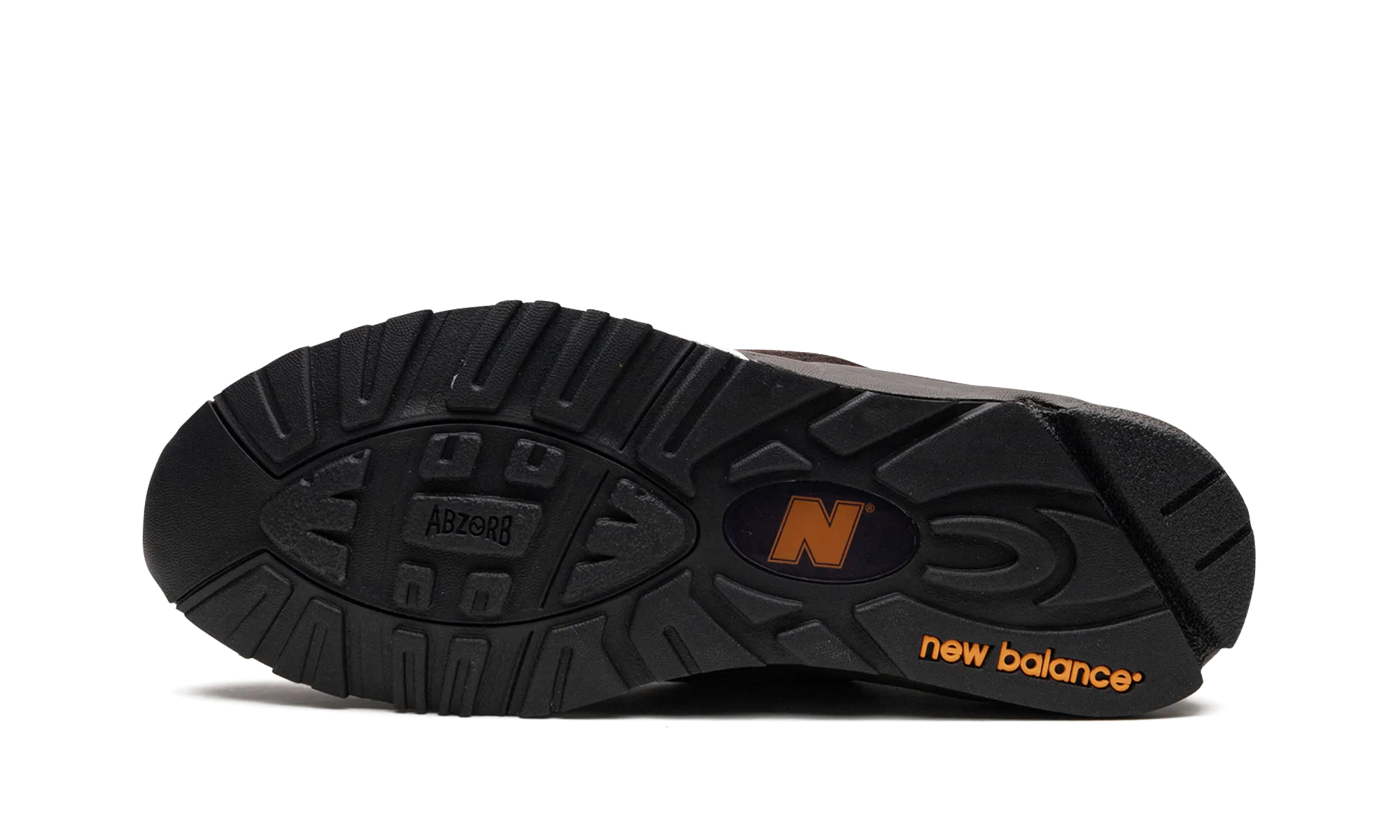 990 v2 "Brown/Orange/Purple" running in a suspension bridge area shoes