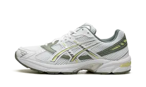 GEL 1130 "White Jade Yellow" running on a dirt path heavy - duty shoes