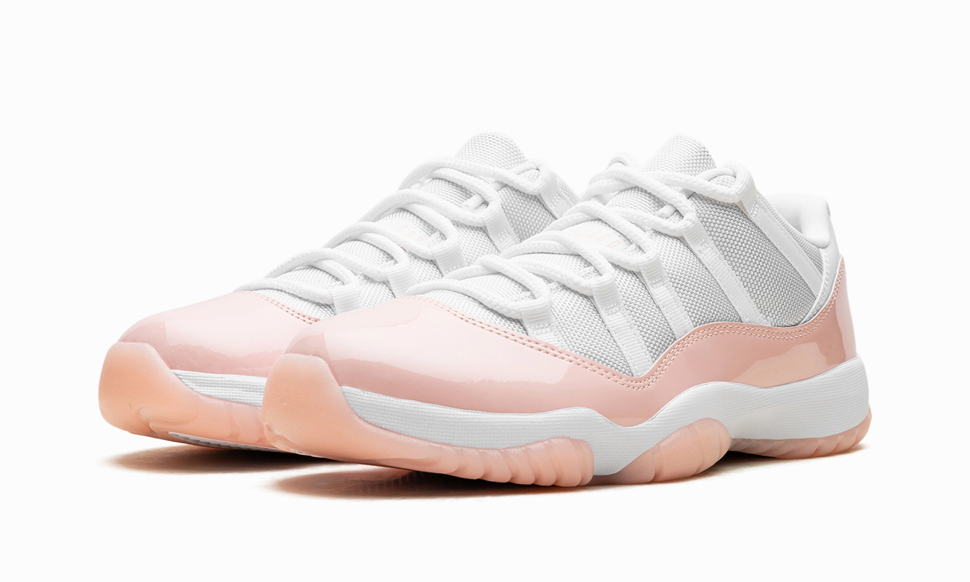 Air Jordan 11 Low WMNS "Legend Pink" running during a windy day