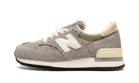 990 V1 "Made In USA - Teddy Santis" running in a taiga area shoes