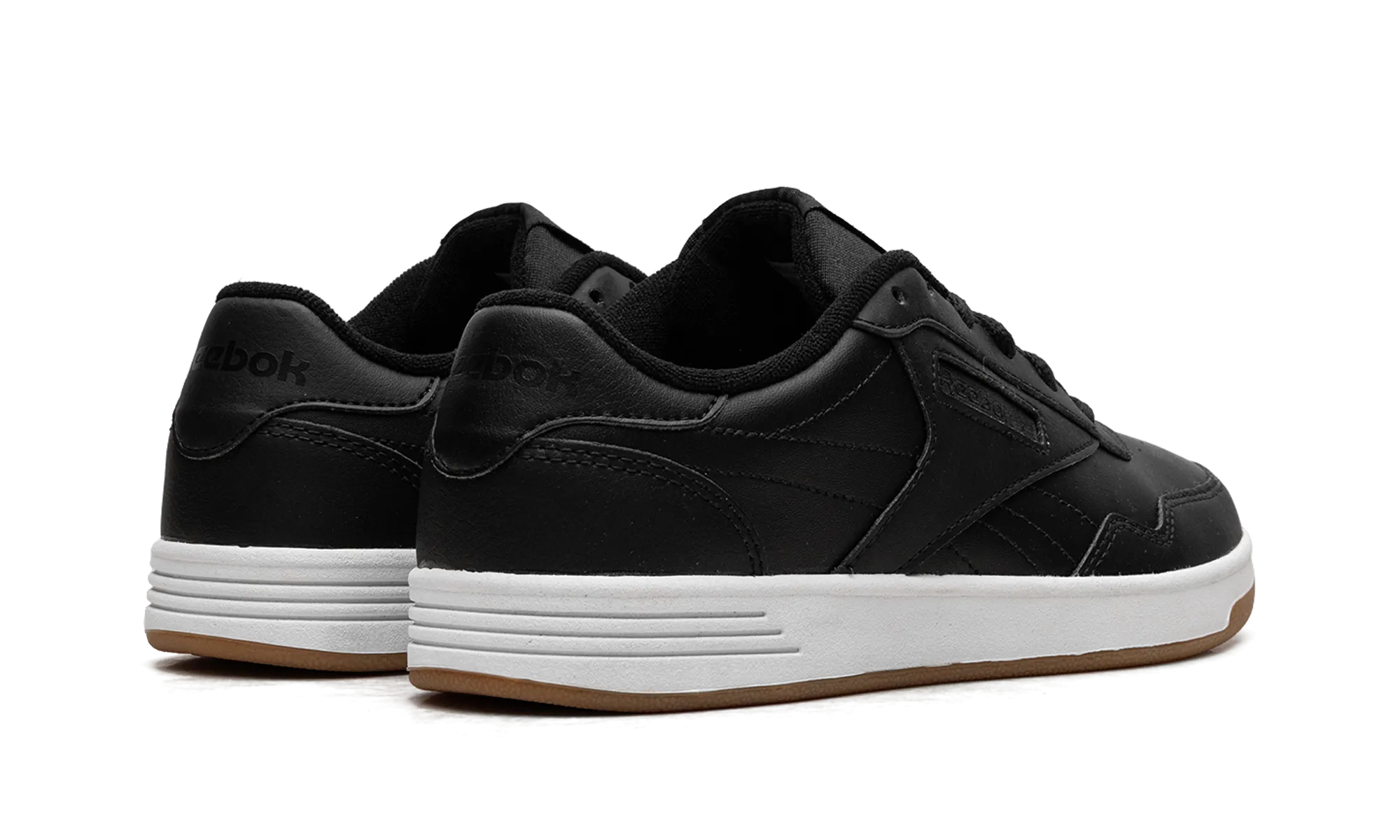 Classic Club Memt WMNS "Black White Gum" running in an urban area shoes