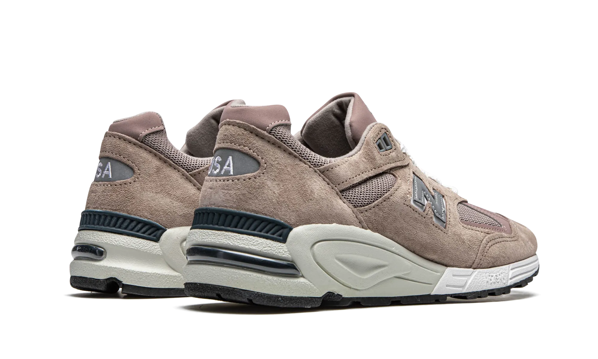 990v2 "Kith - Dusty Rose" running in a forest shoes Strength - improving