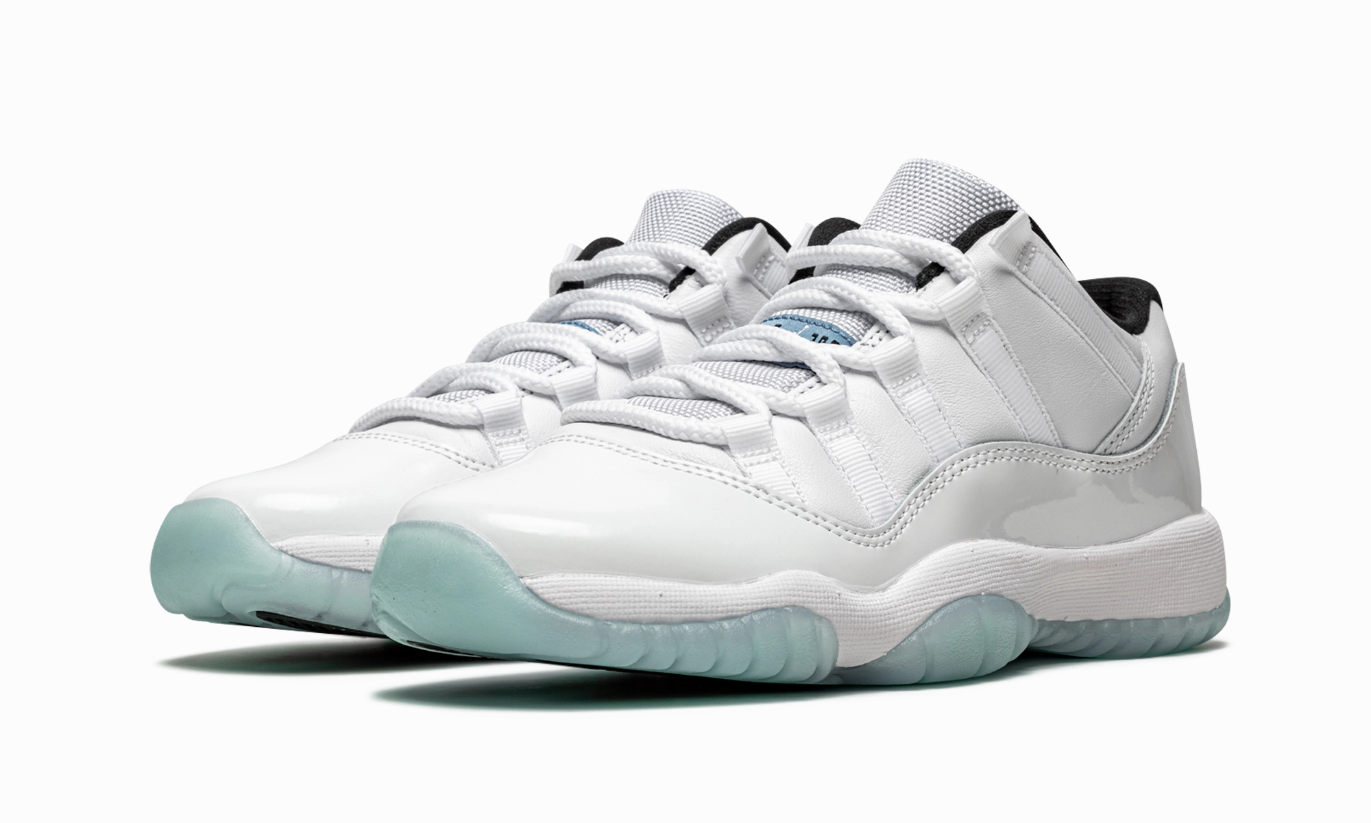 Air Jordan 11 Retro GS "Legend Blue" fluorescent - colored running shoes running in a stadium