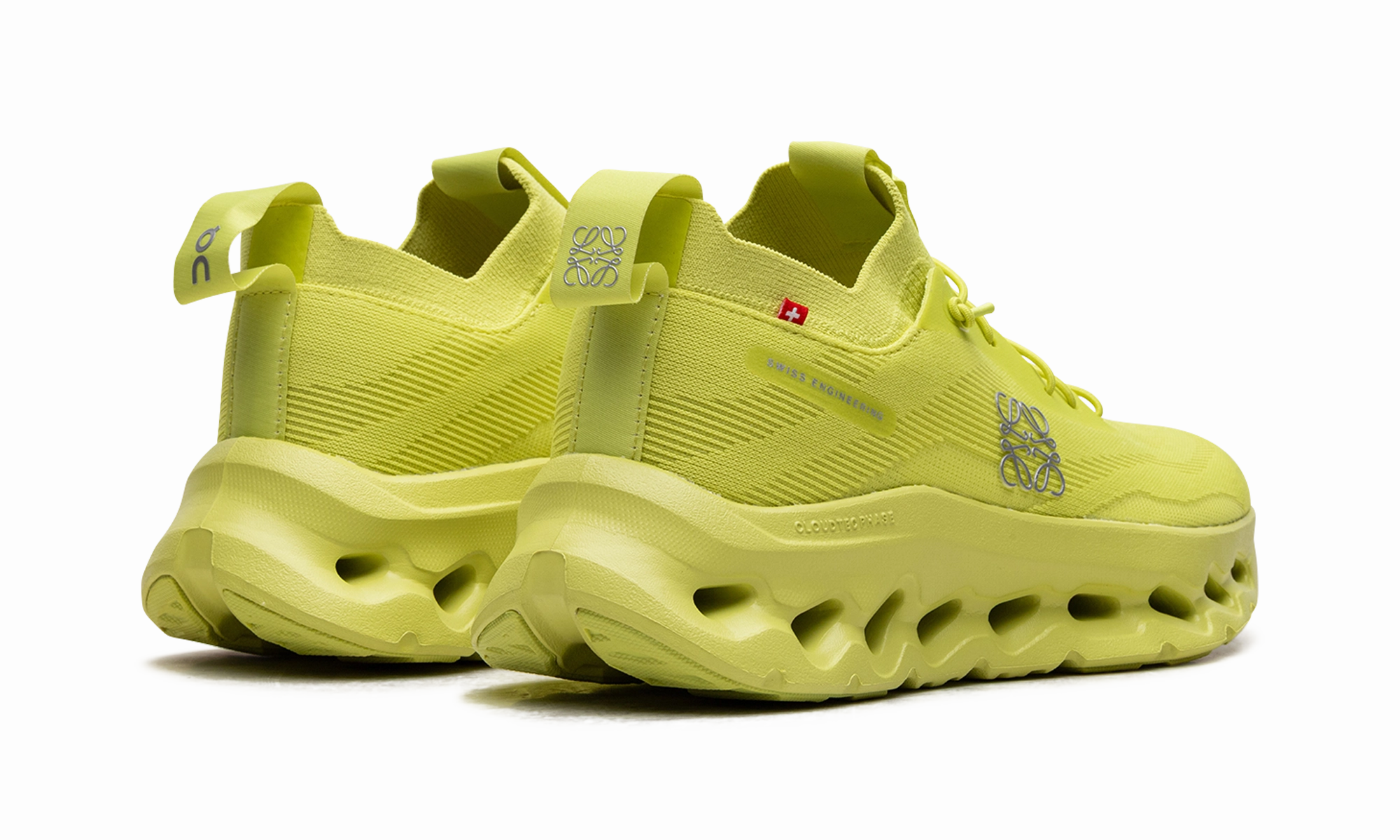 Cloudtilt WMNS "LOEWE - Neon Yellow" running in a reservoir area shoes