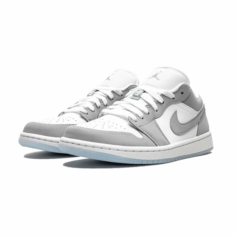 Jordan 1 Low White Wolf Grey running in a pedestrian path area shoes park