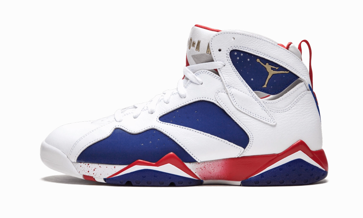 Air Jordan 7 Retro "Tinker Alternate" running with a backpack