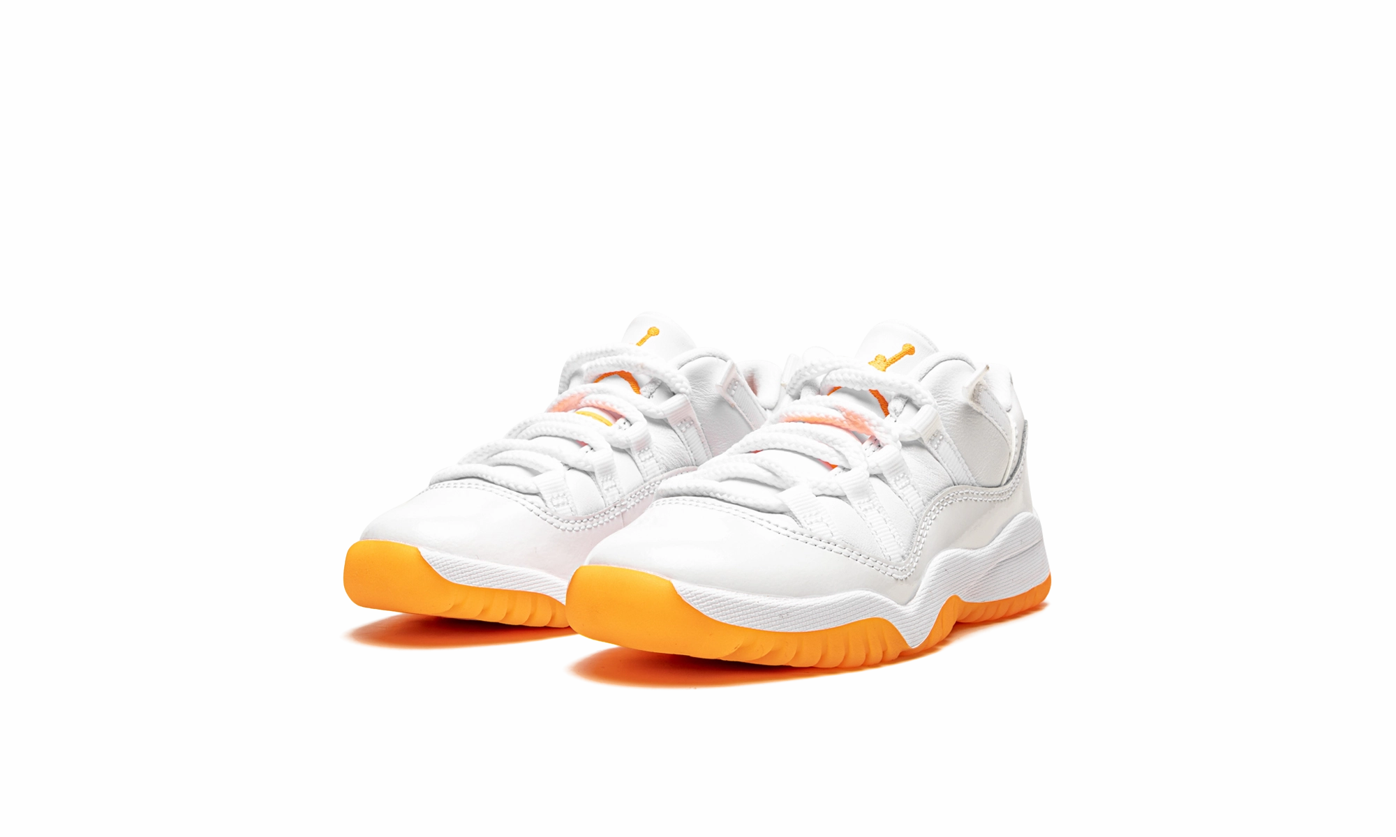 Jordan 11 Retro Low PS "Bright Citrus" running in a mud run