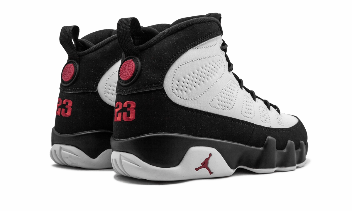 Air Jordan 9 Retro "White Black Red 2016 Release" running in a pedestrian path area shoes