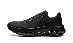 Cloudtilt WMNS "Black Eclipse" running on a grass track shoes