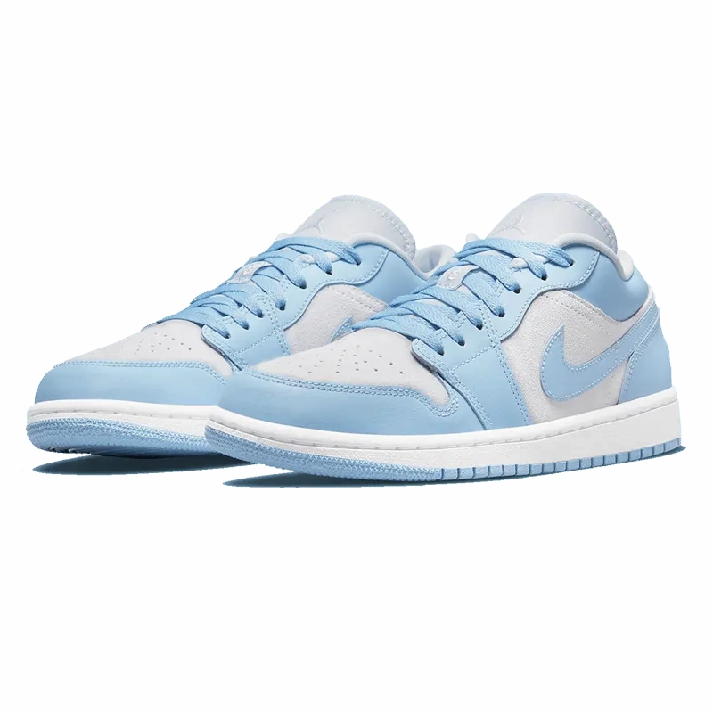 Air Jordan 1 Low University Blue Grey running in a softball field area shoes